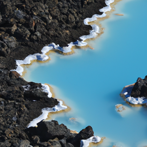 נוף אווירי עוצר נשימה של מי הטורקיז התוססים של הלגונה הכחולה המפורסמת של איסלנד.